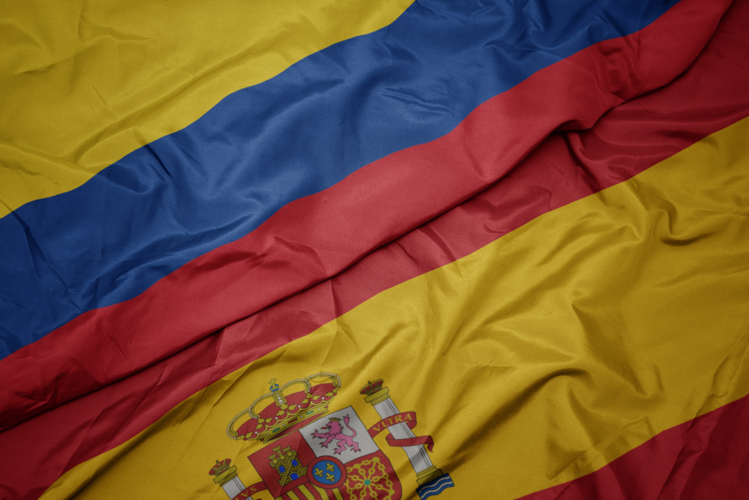 Waving,Colorful,Flag,Of,Spain,And,National,Flag,Of,Colombia.